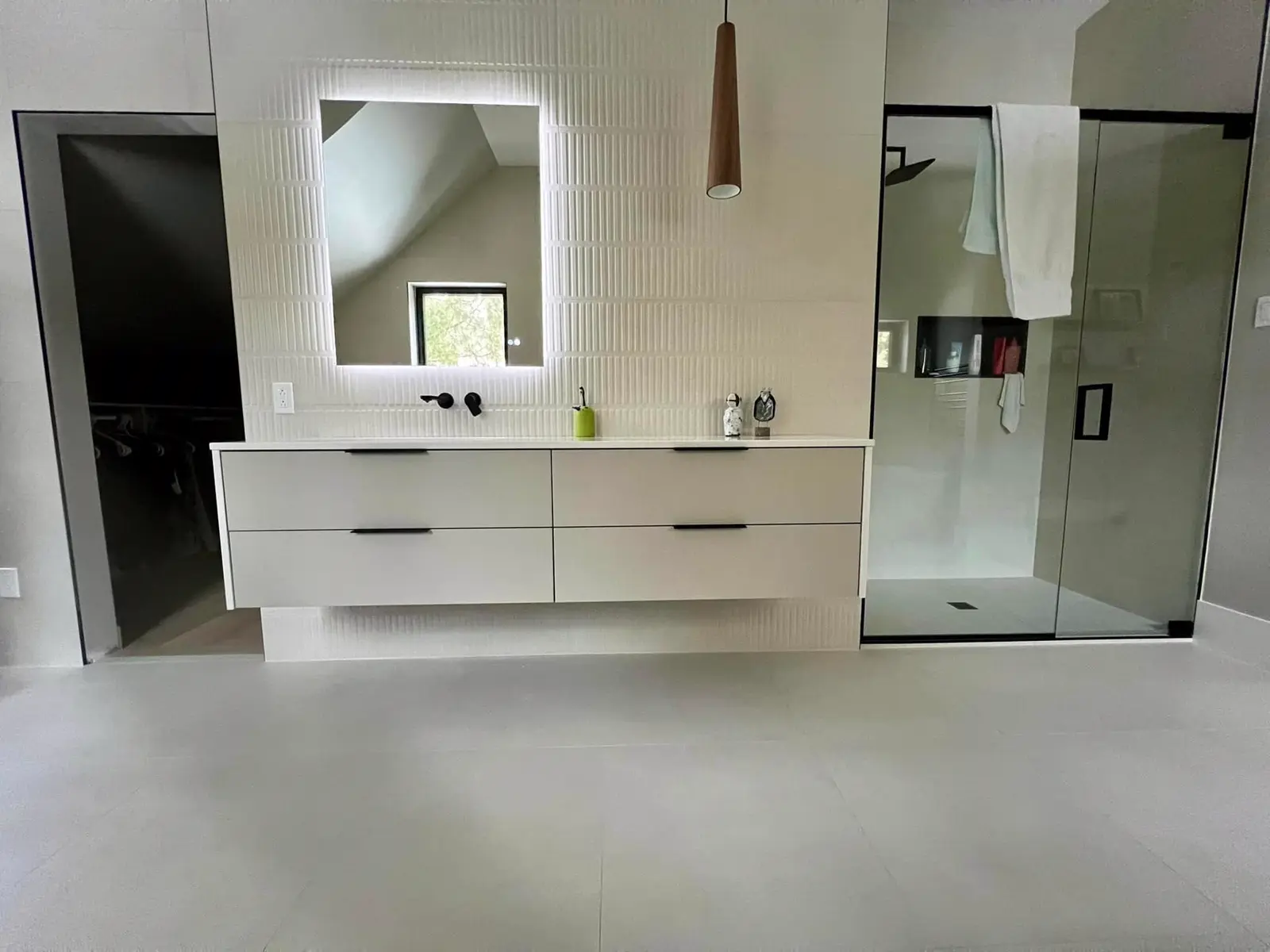 Bathroom with a floating vanity and glass shower, a PRO G2 project