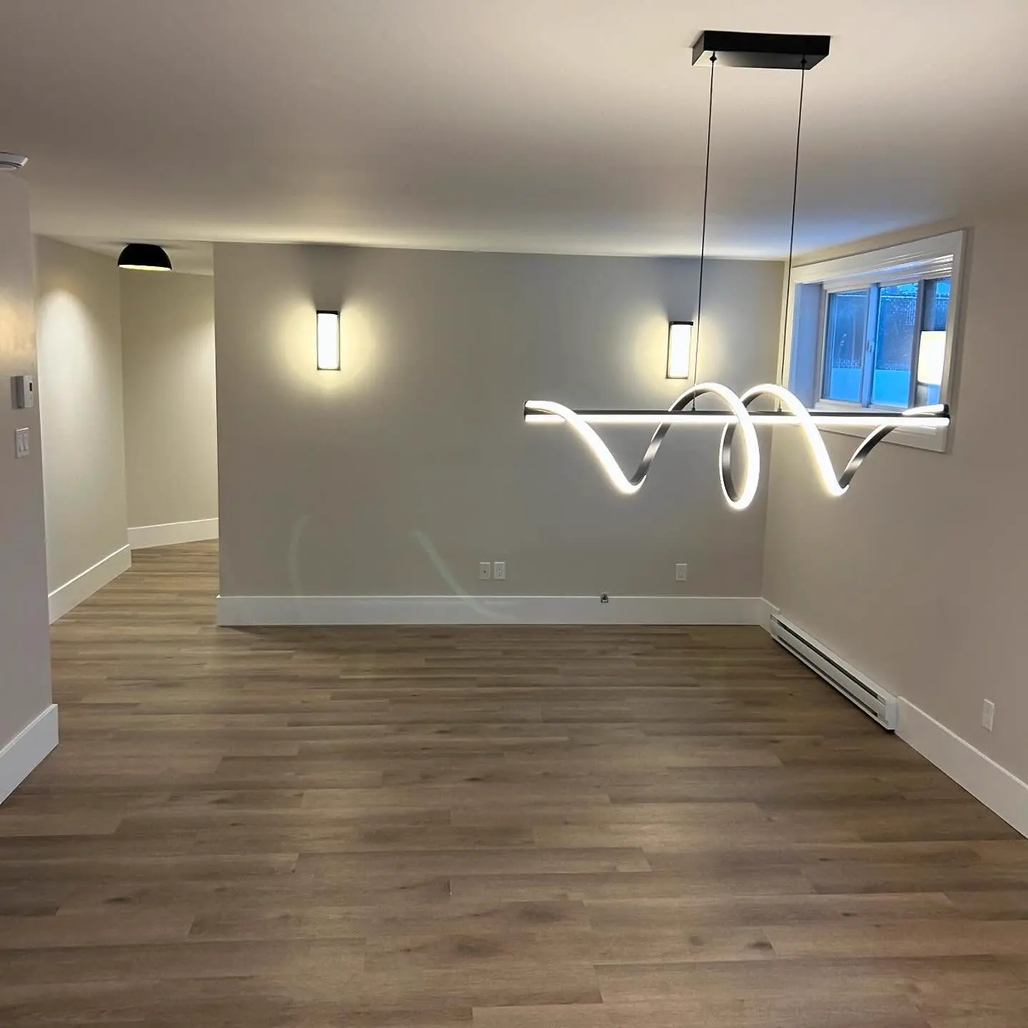 Renovated room with flooring, painted walls and light fixtures, a PRO G2 project